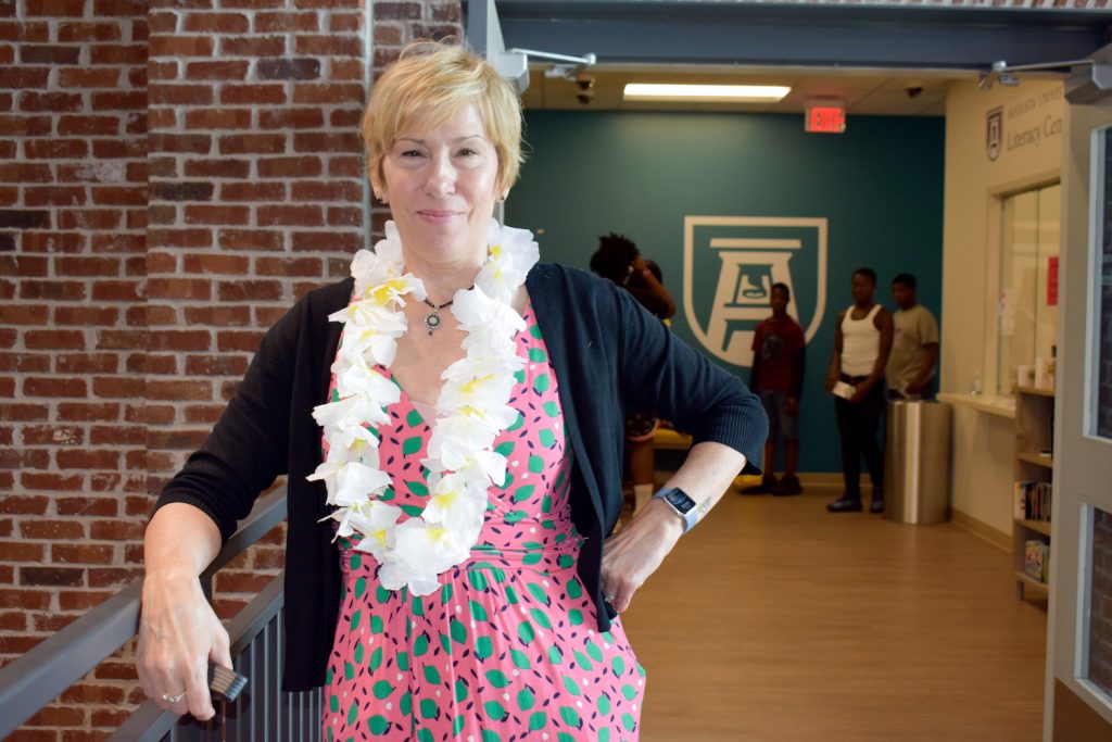 Woman standing at event. 