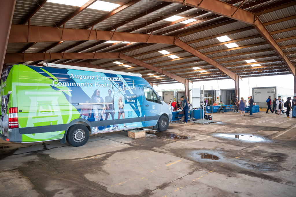 A health care van sits on-site a a health clinic