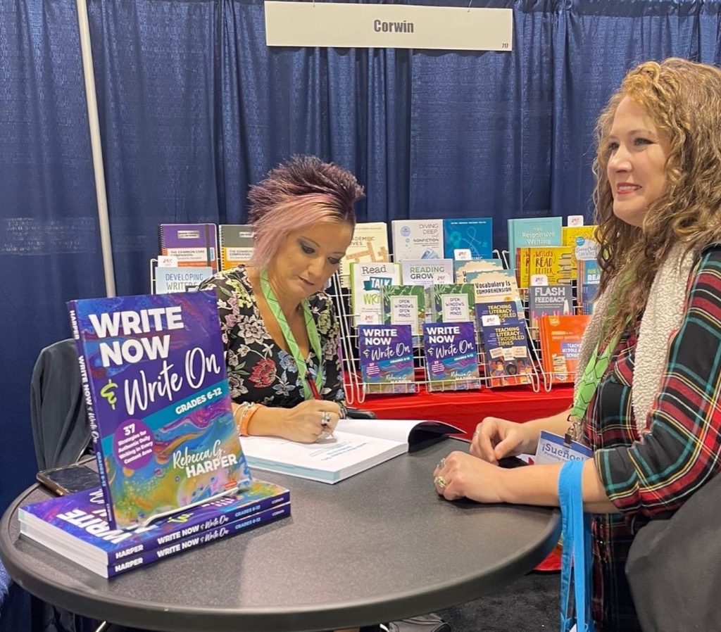 woman signing a book