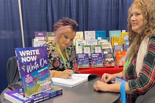 woman signing a book