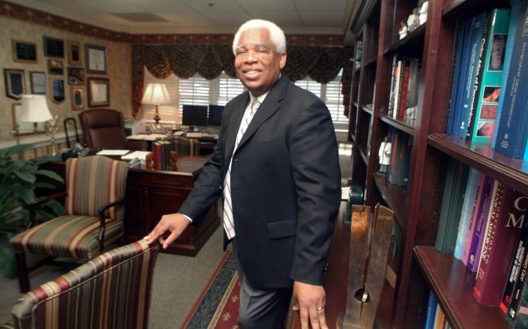 Man in office smiling