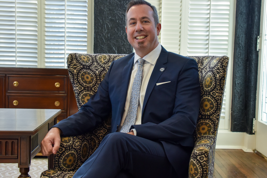 Augusta University Provost Neil MacKinnon sits in chair in his office on the Augusta University Summerville Campus.