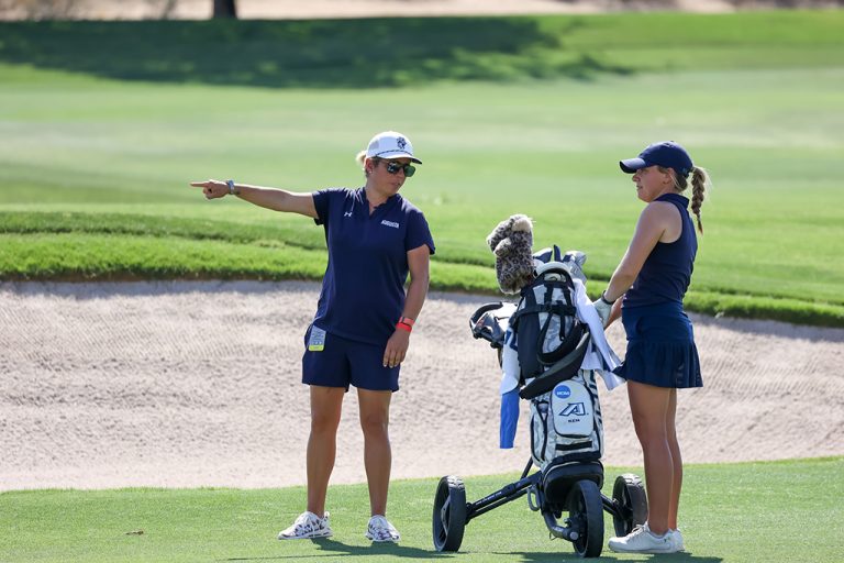 Woman giving another woman instructions