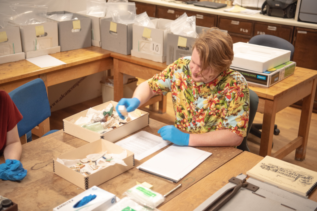 Man working with artifacts.