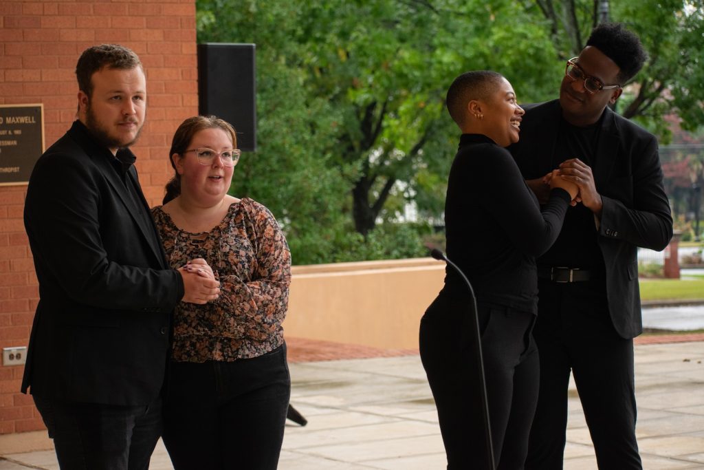 Four opera students performing