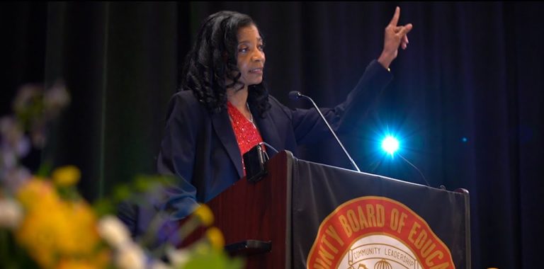 Woman standing at the podium.