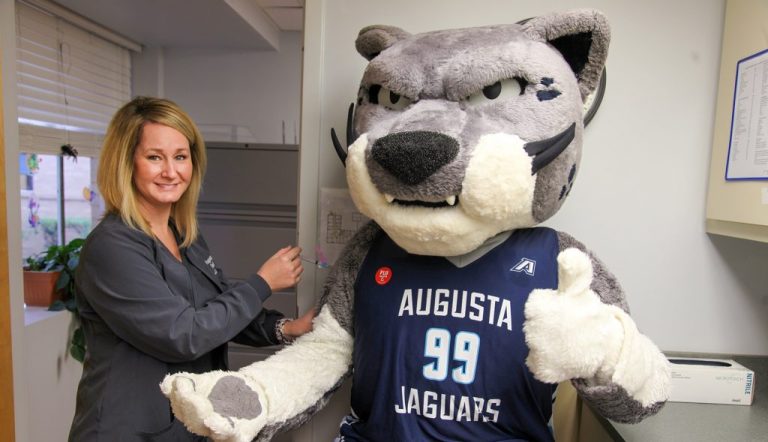 Photo of AU mascot Augustus getting a mock flu shot