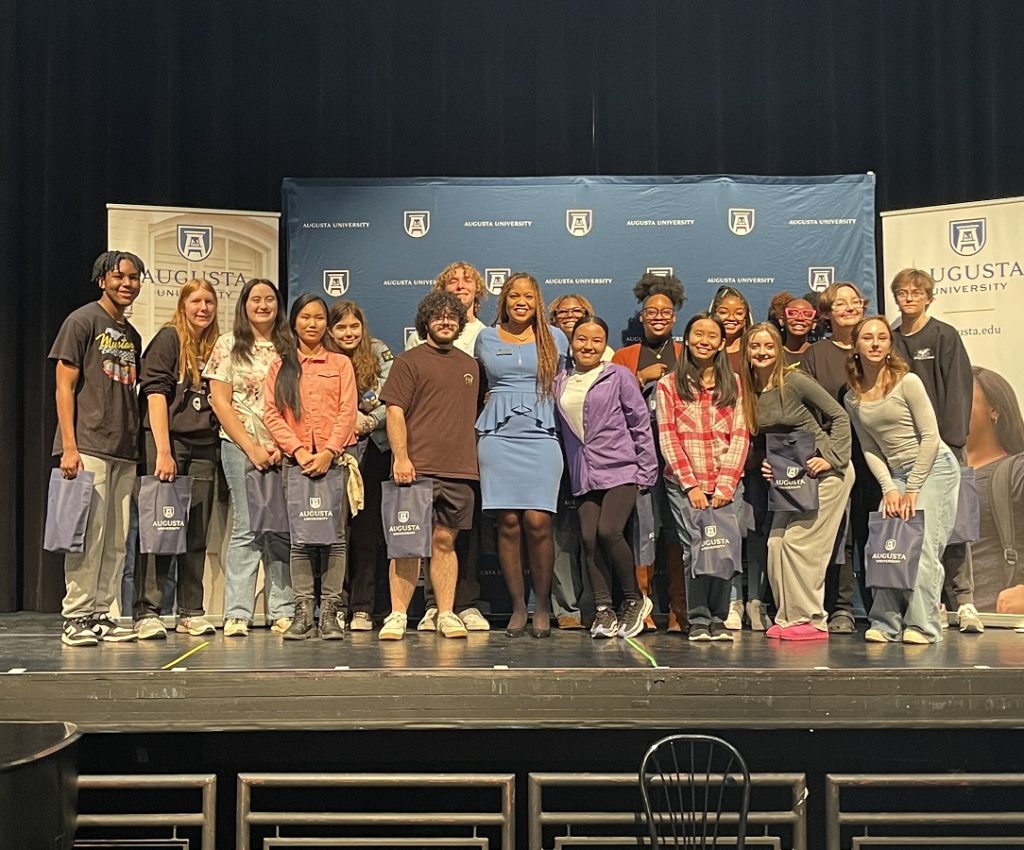 high school students standing on a stage