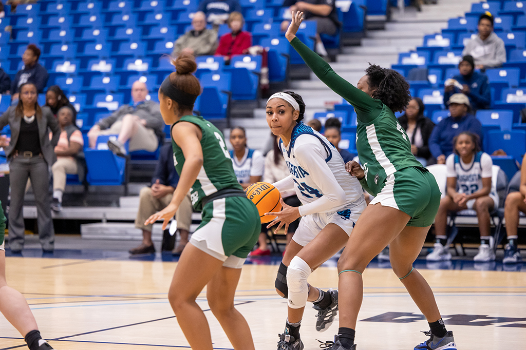 Women playing basketball