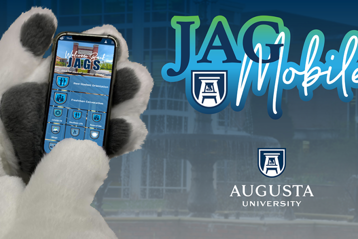 graphic showing a mascot's hand holding a mobile phone with an app pulled up showing several information tiles.