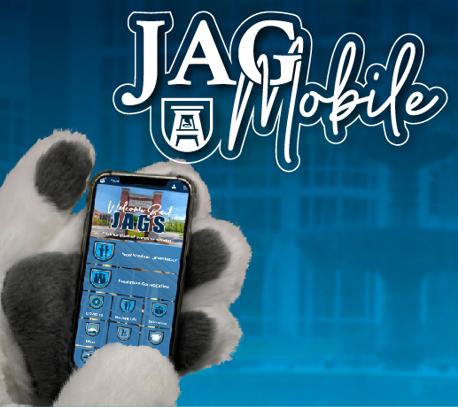 Augustus holds a phone with the words Jag Mobile written on the top of the photo