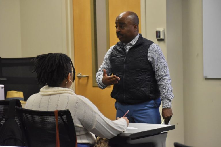 man speaking to students