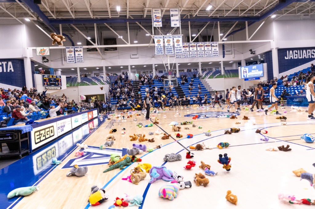 stuffed animals are on a basketball court