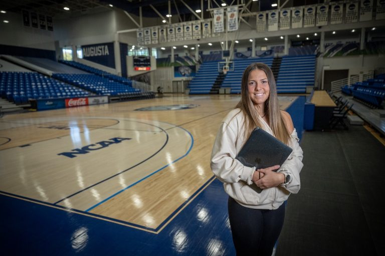 Woman standing on a basketball court