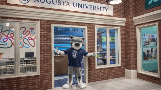 Mascot standing in the storefront