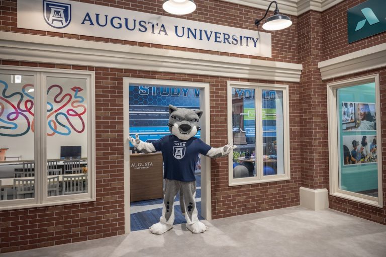 Mascot standing in the storefront