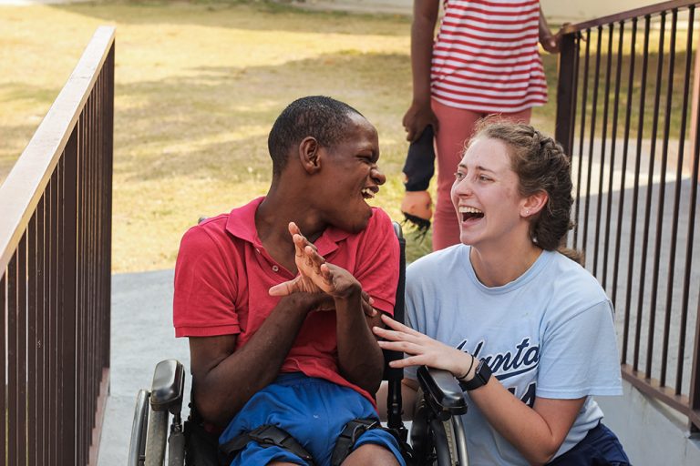 Woman laughing with a man