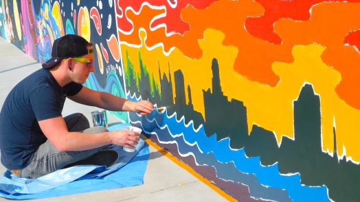 man painting mural