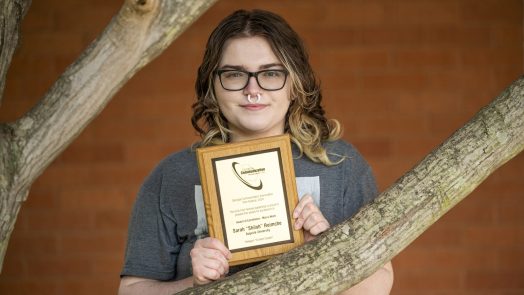 Woman standing with an award