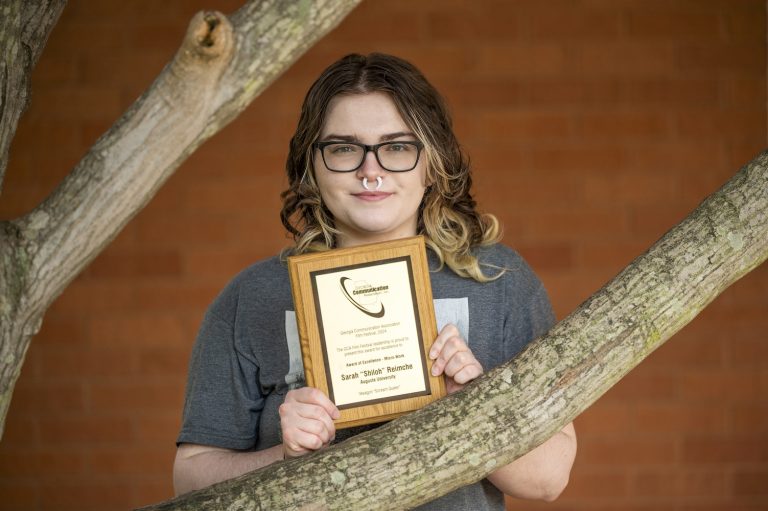 Woman standing with an award