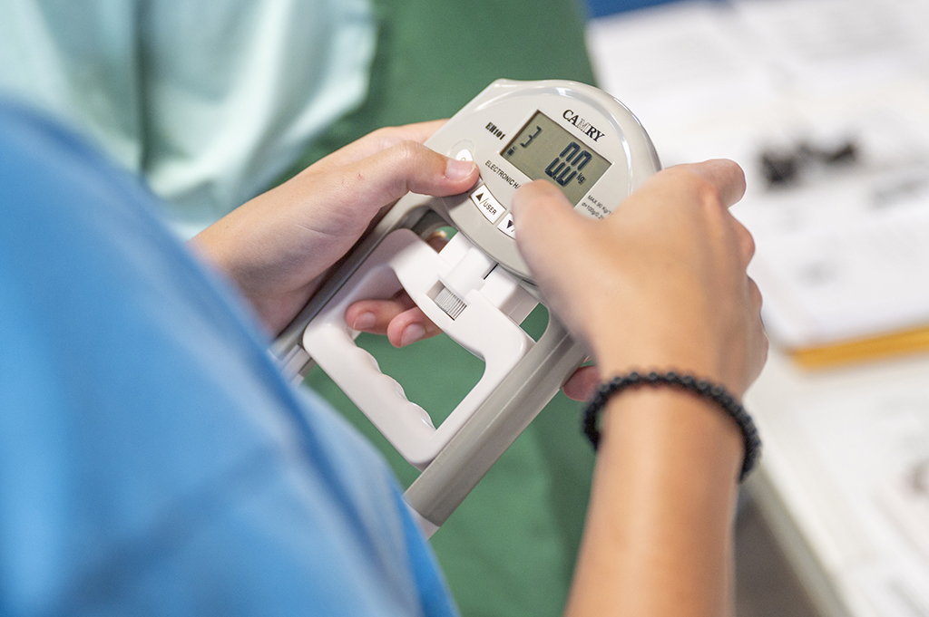 A person holding a medical device