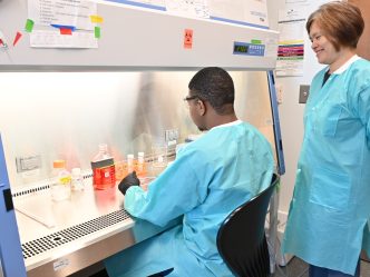 Two people in research laboratory