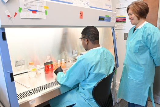 Two people in research laboratory