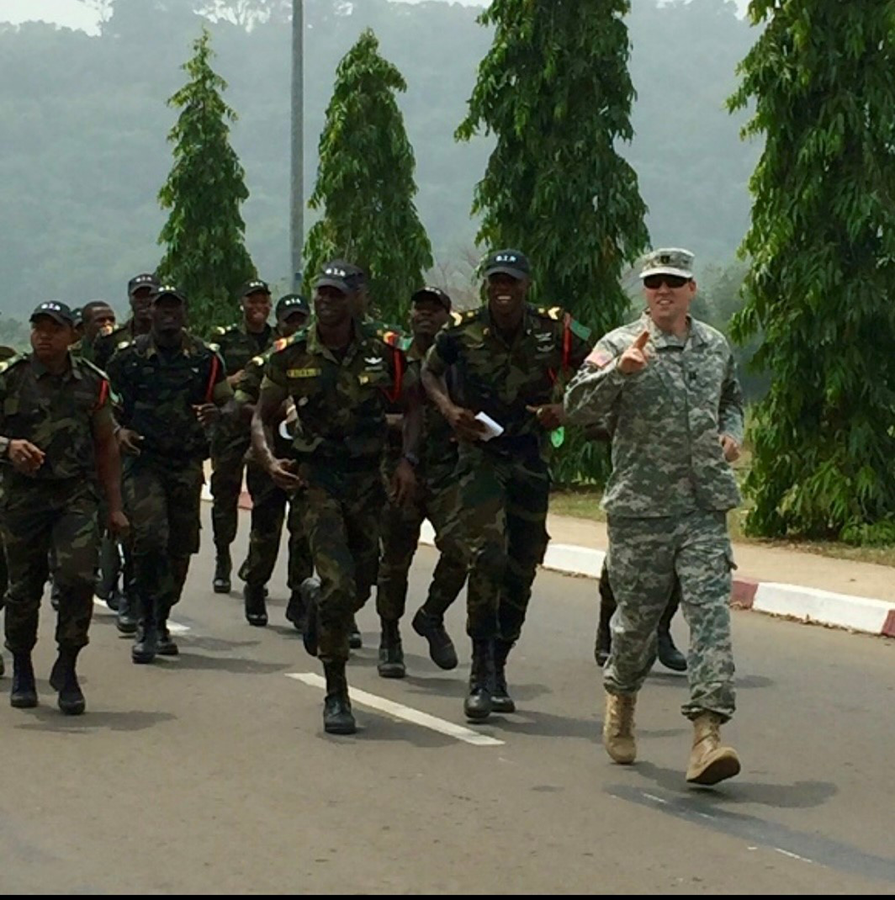 Soldiers running outside during a training exercise.