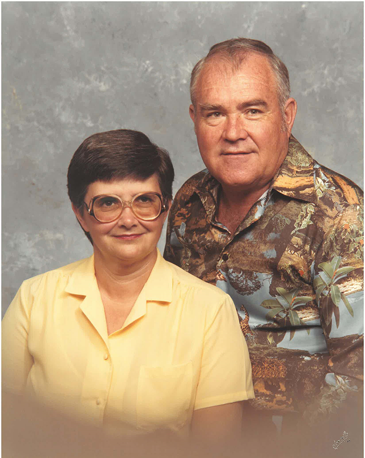 A woman and a man pose for a picture.