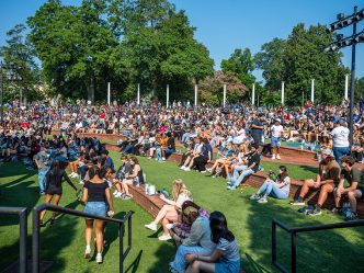 Hundreds of incoming freshman take part in Freshman Convocation on the grassy steps outside the JSAC