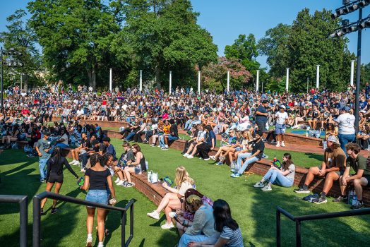 Hundreds of incoming freshman take part in Freshman Convocation on the grassy steps outside the JSAC