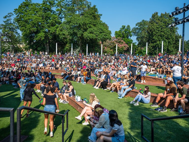 Hundreds of incoming freshman take part in Freshman Convocation on the grassy steps outside the JSAC