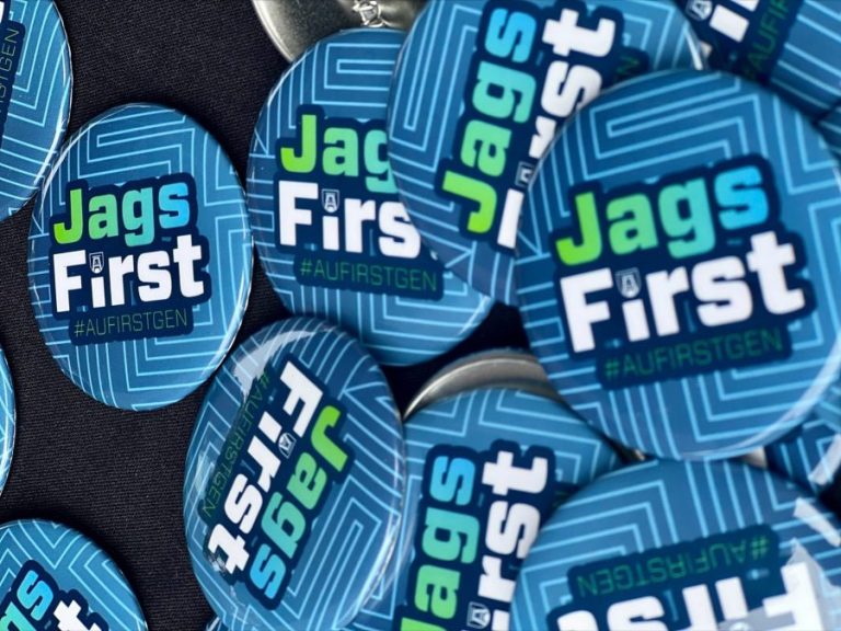 Blue push pin buttons that read "Jags First."