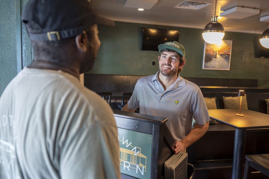 Owner of Midtown Tavern greeting guests