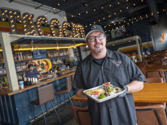 Man holding a plate of food.