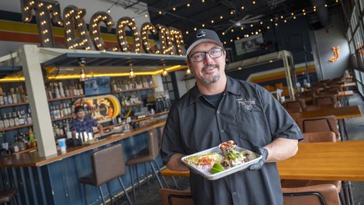 Man holding a plate of food.