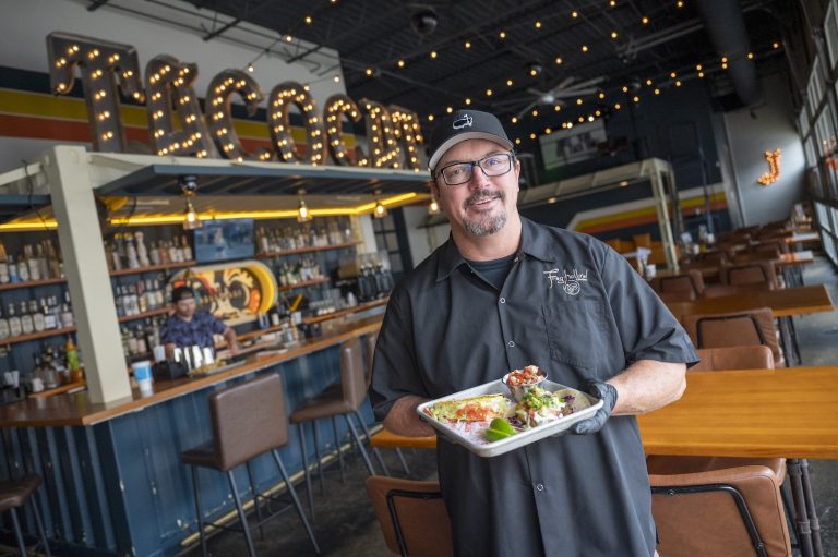 Man holding a plate of food.