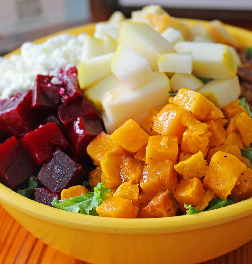 A dish of beets, sweet potatoes, potatoes and cottage cheese.