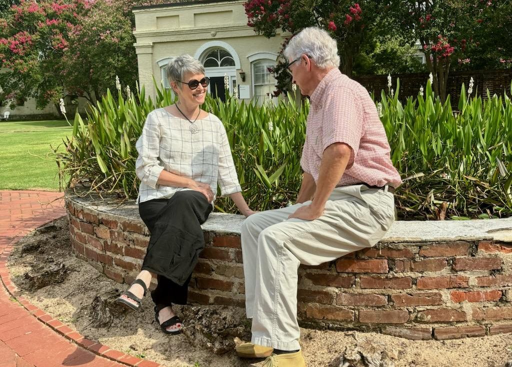 Couple seated in garden