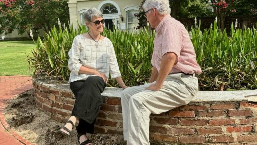 Couple seated in garden