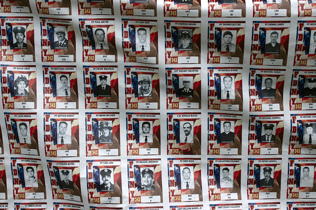 Banner displays photos of NYFD firefighters who died in the attacks of 9/11