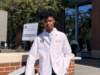 Man posing in a medical professional's coat