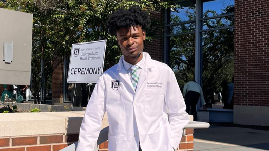 Man posing in a medical professional's coat