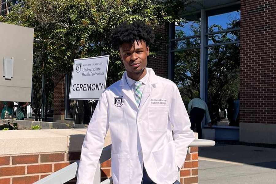 Man posing in a medical professional's coat