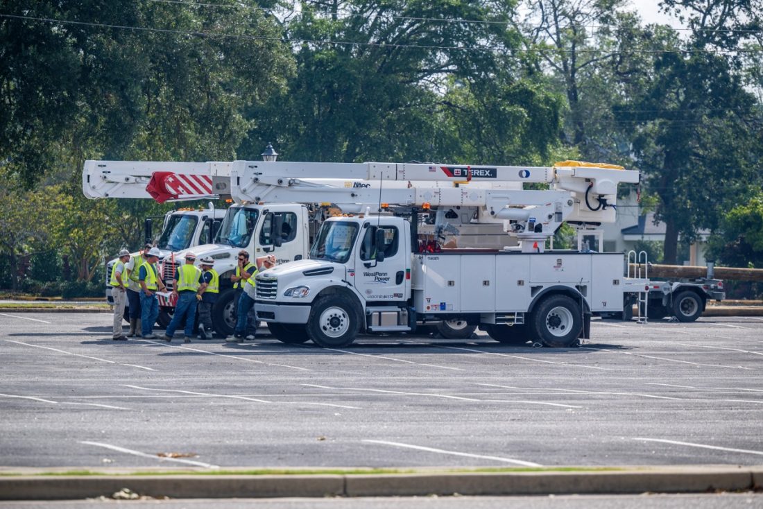 Utility trucks are parked.