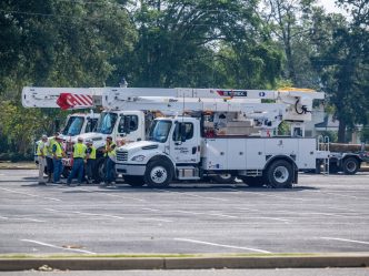 Utility trucks are parked.