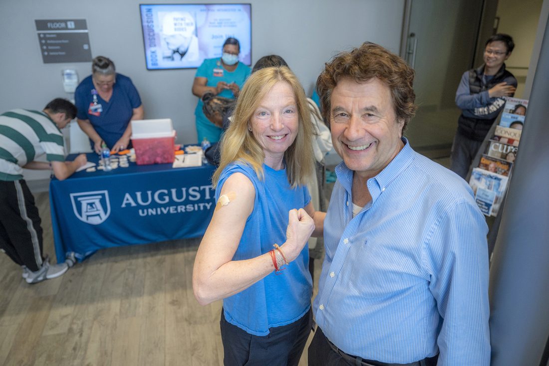 Two people at flu shot clinic