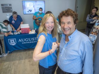 Two people at flu shot clinic