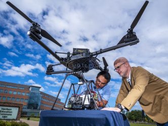 Two people with the drone