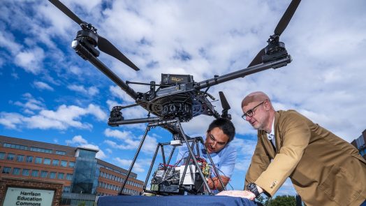 Two people with the drone